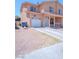 Two-story home with covered porch, white garage door and easy to maintain desert landscaping at 2906 Cedar Ave, Las Vegas, NV 89101