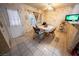The eat-in kitchen features tile floors, a ceiling fan, and access to the backyard at 2906 Cedar Ave, Las Vegas, NV 89101