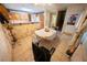 Eat-in kitchen features a breakfast bar, tile flooring, and access to the stairway at 2906 Cedar Ave, Las Vegas, NV 89101