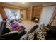 Living room features tile flooring, neutral paint, couches, and natural light at 2906 Cedar Ave, Las Vegas, NV 89101