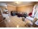 Living room features tile flooring, neutral paint, couches, and natural light at 2906 Cedar Ave, Las Vegas, NV 89101
