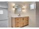 Bathroom vanity with soft-close drawers, black hardware, quartz countertop, and modern light fixtures at 3386 El Camino Real, Las Vegas, NV 89121
