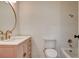 Bathroom featuring a vanity with quartz counters, gold accents, and tiled shower-tub at 3386 El Camino Real, Las Vegas, NV 89121