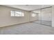 Spacious carpeted bedroom with mirrored closet, base moulding, and natural light at 3386 El Camino Real, Las Vegas, NV 89121
