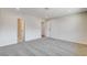 Carpeted bedroom featuring base moulding and direct access to bathroom and living room at 3386 El Camino Real, Las Vegas, NV 89121