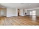 Spacious living room featuring wood floors, a stone fireplace, and sliding glass doors at 3386 El Camino Real, Las Vegas, NV 89121
