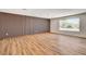 Well-lit living room with wood flooring and modern wall accents at 3386 El Camino Real, Las Vegas, NV 89121