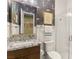 Stylish bathroom with modern fixtures, granite counters, and decorative wallpaper at 3395 Stone View Ave, Henderson, NV 89044