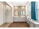 Bright primary bathroom features granite counters, double sinks, a large shower, and modern fixtures at 3395 Stone View Ave, Henderson, NV 89044