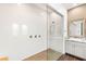 Bright primary bathroom features a walk in shower and granite counters with a single sink at 3395 Stone View Ave, Henderson, NV 89044