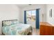 Bright bedroom features a comfortable bed and a large window with exterior views at 3395 Stone View Ave, Henderson, NV 89044
