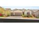 Charming single-story home with a two-car garage, desert landscaping and attractive brick paved driveway at 3395 Stone View Ave, Henderson, NV 89044