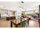 Light-filled open concept with chef's kitchen, dining area, and living room, seamlessly connecting indoor and outdoor spaces at 3395 Stone View Ave, Henderson, NV 89044