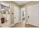 Hallway with doors to bathroom and bedroom featuring wood-look tile flooring at 3395 Stone View Ave, Henderson, NV 89044