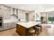 Modern kitchen with an oversized island, marble countertops, and stainless steel appliances, perfect for entertaining at 3395 Stone View Ave, Henderson, NV 89044