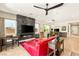 Bright living room featuring a marble fireplace, flat screen TV, wood floors and modern lighting at 3395 Stone View Ave, Henderson, NV 89044