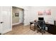 Well-lit office with modern desk and chair, light wood tile, and neutral decor at 3395 Stone View Ave, Henderson, NV 89044