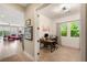 Office featuring modern desk setup, bright window and view to spacious living room at 3395 Stone View Ave, Henderson, NV 89044