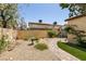 Well-maintained backyard with desert landscaping and a stone pathway at 3890 Lancome St, Las Vegas, NV 89115