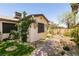 Backyard featuring decorative rock and gravel, pavers and artificial turf at 3890 Lancome St, Las Vegas, NV 89115