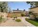 Backyard featuring decorative gravel, artificial turf, pavers and stone bird bath at 3890 Lancome St, Las Vegas, NV 89115