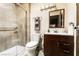 Modern bathroom with a glass-enclosed shower and dark wood vanity at 3890 Lancome St, Las Vegas, NV 89115