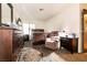 Comfortable bedroom with a dresser, TV, bed, and a cozy recliner chair at 3890 Lancome St, Las Vegas, NV 89115