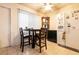 Dining area featuring tiled floors, natural light and stainless steel refrigerator at 3890 Lancome St, Las Vegas, NV 89115