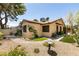 Charming single-story home with a landscaped front yard and patio seating at 3890 Lancome St, Las Vegas, NV 89115