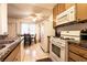 Kitchen featuring tiled floors, dining area and stainless steel and white appliances at 3890 Lancome St, Las Vegas, NV 89115