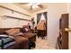 Cozy living room with a large sectional sofa and tiled flooring at 3890 Lancome St, Las Vegas, NV 89115