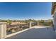 Spacious balcony with black metal railing offering views of the neighborhood and palm trees at 3892 Pasilla Ave, Las Vegas, NV 89118