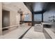 Spa-like bathroom with textured tile, glass shower, soaking tub, and modern fixtures at 3892 Pasilla Ave, Las Vegas, NV 89118