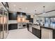 Contemporary kitchen featuring stainless steel appliances, designer lighting, and a large center island at 3892 Pasilla Ave, Las Vegas, NV 89118