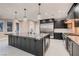Spacious kitchen with large island, stainless steel appliances, and pendant lighting fixtures at 3892 Pasilla Ave, Las Vegas, NV 89118
