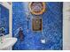 Unique bathroom with custom painted walls, stylish decor and a modern sink at 392 Canary Song Dr, Henderson, NV 89011