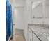 Granite counter with a white sink and lots of open space with a mirror at 392 Canary Song Dr, Henderson, NV 89011