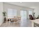 Bright dining area features tile flooring, neutral walls, and sliding glass door providing natural light at 392 Canary Song Dr, Henderson, NV 89011