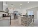 Modern kitchen features white cabinets, stainless steel appliances, and granite countertops at 392 Canary Song Dr, Henderson, NV 89011
