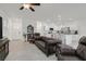Open concept living room, adjacent to kitchen, features tile flooring and recessed lighting at 392 Canary Song Dr, Henderson, NV 89011