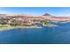 Scenic community with waterfront homes, golf course, and mountain backdrop at 40 Heron Harbour Dr, Henderson, NV 89011