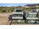 Luxury home with multiple balconies, outdoor seating, and a private hot tub at 40 Heron Harbour Dr, Henderson, NV 89011