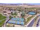 Upscale community featuring multiple pickleball courts, a clubhouse, swimming pool, and lush landscaping at 40 Heron Harbour Dr, Henderson, NV 89011