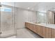 Bright bathroom with marble-tiled shower, floating vanity, and spacious layout at 40 Heron Harbour Dr, Henderson, NV 89011