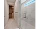 Contemporary bathroom showcasing a glass-enclosed shower and access to a walk-in closet at 40 Heron Harbour Dr, Henderson, NV 89011
