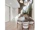Bright and airy dining room with modern pendant lighting and a large dining table with seating for eight at 40 Heron Harbour Dr, Henderson, NV 89011