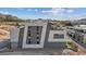 Modern multi-story home exterior showing contemporary architectural design with geometric shapes and gray and white color scheme at 40 Heron Harbour Dr, Henderson, NV 89011