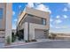 Modern home with stylish architecture, two-car garage, and desert landscaping at 40 Heron Harbour Dr, Henderson, NV 89011