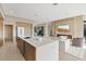 Modern kitchen flows into the living room with a large island and stylish appliances at 40 Heron Harbour Dr, Henderson, NV 89011