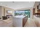 Sleek kitchen and living room combo features white countertops, modern appliances, and fireplace at 40 Heron Harbour Dr, Henderson, NV 89011